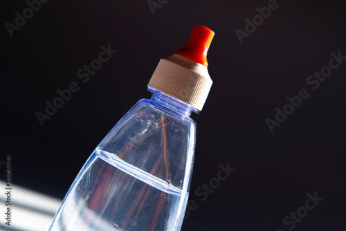 diet sweetener bottle on window light background photo