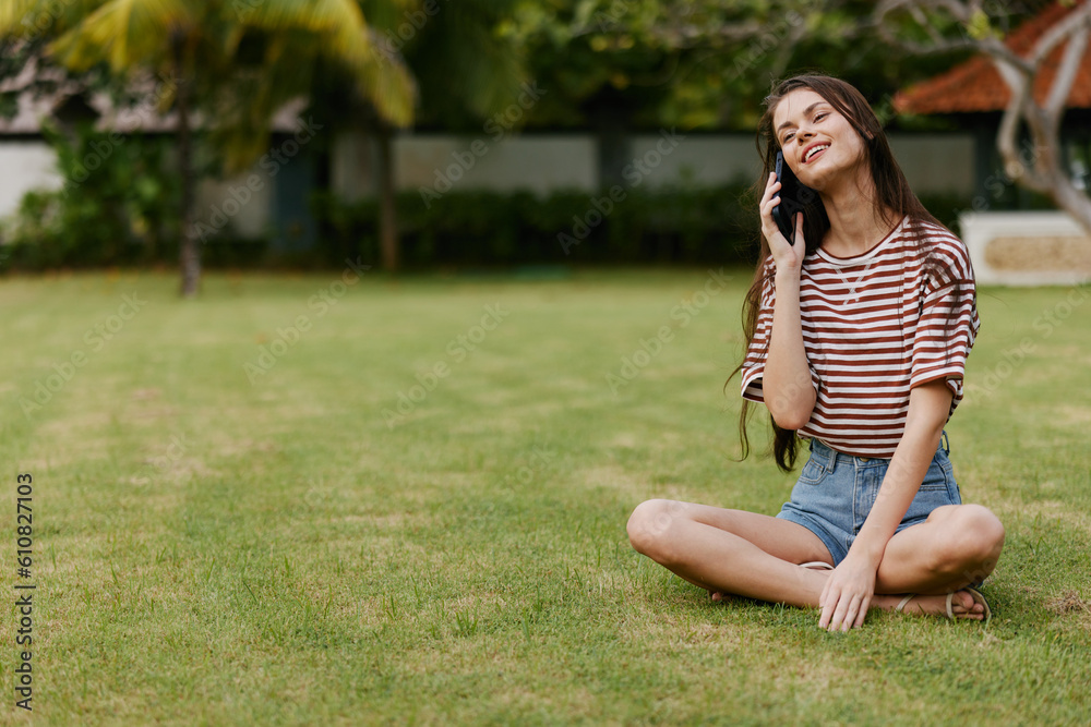 adult woman phone tree grass nature palm lifestyle smiling park blogger happy adult woman phone tree grass nature palm lifestyle smiling park blogger happy