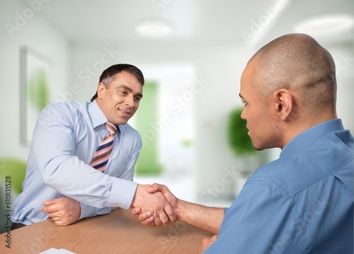 Happy business people handshake at meeting in office