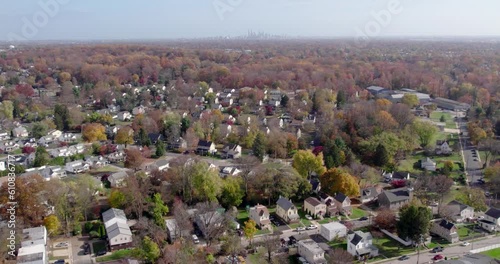 Drone Soaring over Springfield, PA, Revealing Hazy Philadelphia Skyline in Fall Suburban Charm in Montgomery County photo