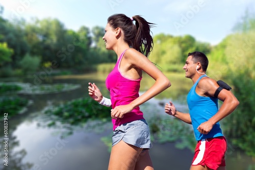 Happy young couple running together