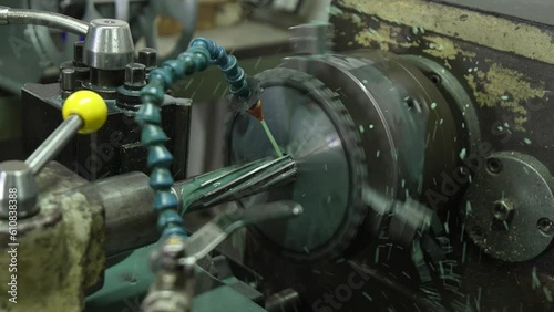 Engineering an alloy sprocket through a reaming process on a lathe machine with great precision.
