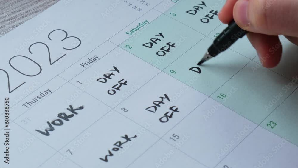 4 day work week printed calendar with weekend days four day working week concept. Female hand writing planning Modern approach doing business short workweek. Effectiveness of employees. Productivity 4 day work week printed calendar with weekend days four day working week concept. Female hand writing planning Modern approach doing business short workweek. Effectiveness of employees. Productivity