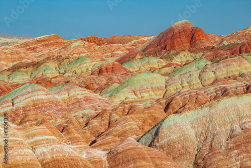 Aerial top down view on Zhangye Rainbow mountains displaying colorful pattern