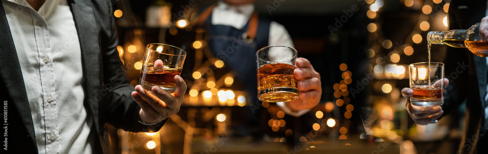  Barman pouring whiskey whiskey glass celebrate whiskey on a friendly party in  restaurant