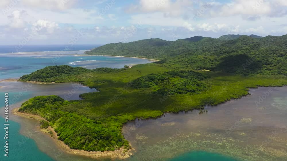 Aerial view of tropical island with jungle and tropical vegetation. Palaui Island. Santa Ana, Cagayan. Philippines. Aerial view of tropical island with jungle and tropical vegetation. Palaui Island. Santa Ana, Cagayan. Philippines.