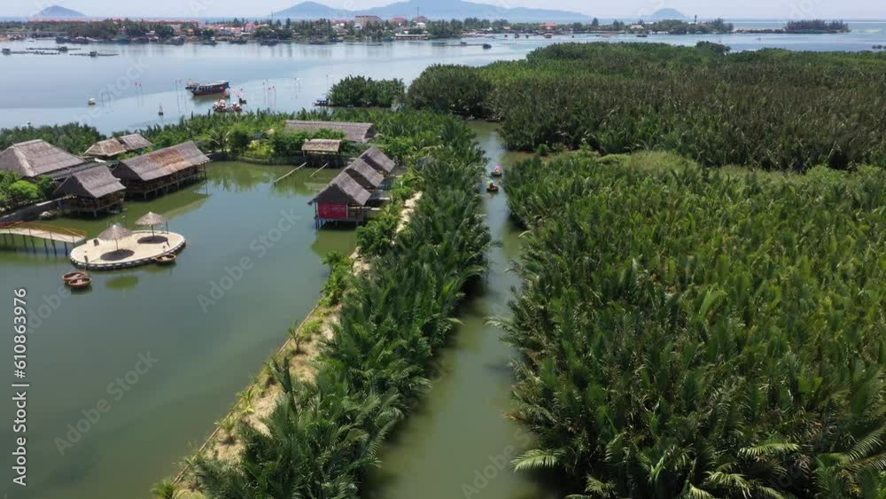 Coconut village eco tour in Hoi An Vietnam with Bamboo basket boats on Thu Bon River, Aerial pan up shot Coconut village eco tour in Hoi An Vietnam with Bamboo basket boats on Thu Bon River, Aerial pan up shot