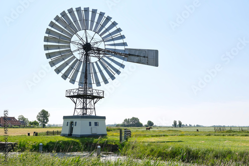  American wind engine from 1920 near Weidum in Friesland The Netherlands. Nowadays a reserve pumping station in case of serious flooding. photo