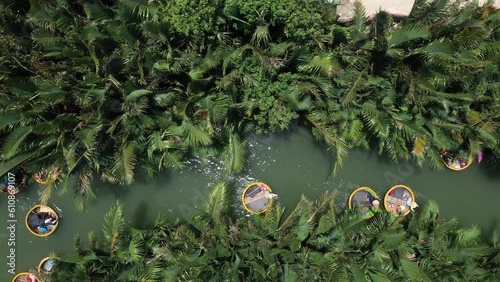 Coconut village eco tour in Hoi An Vietnam with Bamboo basket boats on Thu Bon River, Aerial pan up shot
