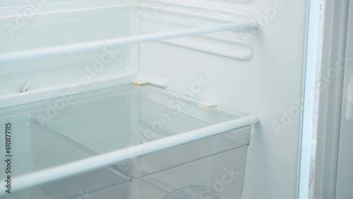 Wallpaper Mural Empty shelves of home household refrigerator. Smooth camera movement Torontodigital.ca