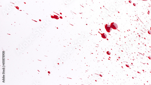 Many drops of red blood spread on white background.