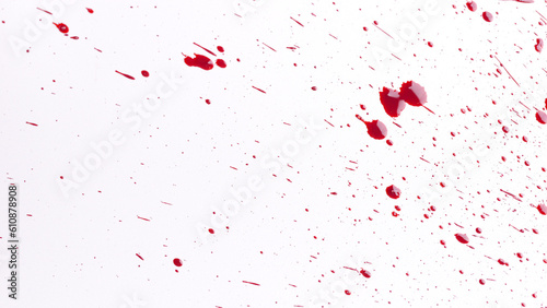 Fotografie Many drops of red blood spread on white background.