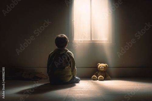 Boy sitting with teddy bear and facing an empty wall. Depression, autism concept. Generative AI