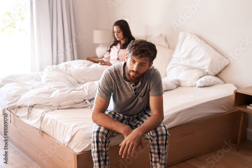 Home bed, man and couple with problem, marriage conflict or stress over mistake, life fail or insomnia. Mental health risk, mistake and person depressed, sad and thinking about divorce in bedroom