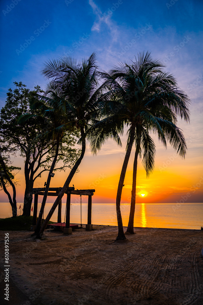 Beachfront sunrise with pool and palm trees in Hua Hin, Prachuap Khiri Khan, Thailand