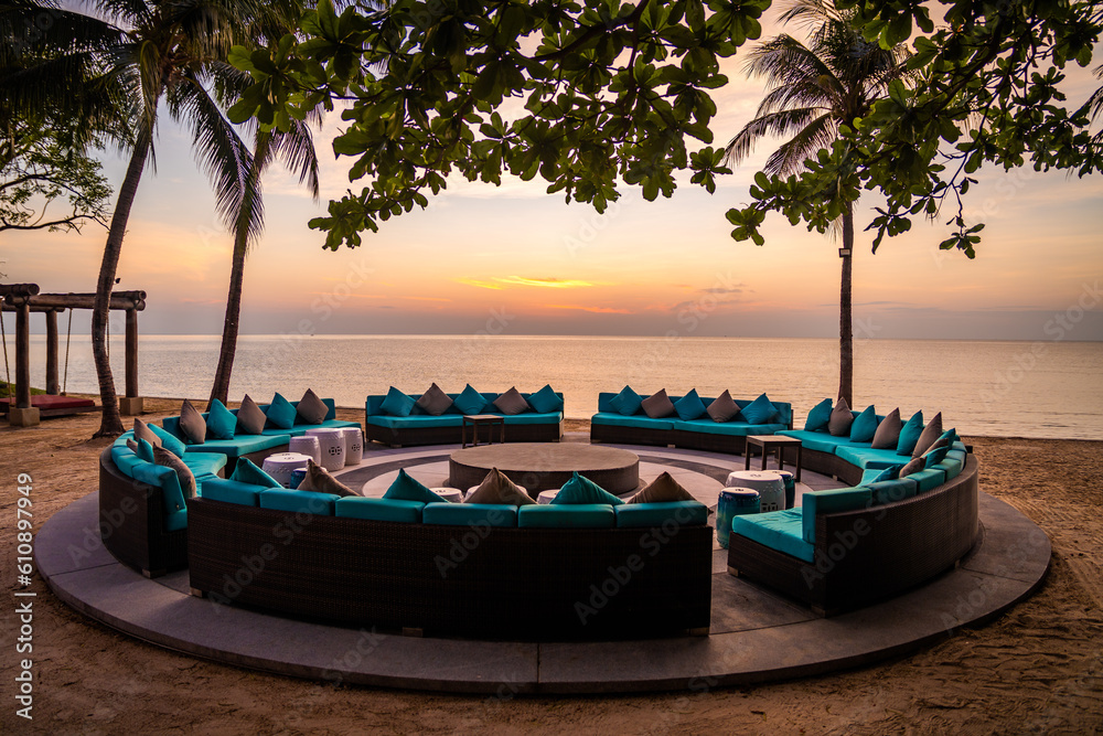 Beachfront sunrise with pool and palm trees in Hua Hin, Prachuap Khiri Khan, Thailand