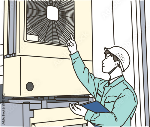 室外機を点検する男性作業員
