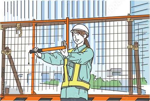 工事現場で警備をする作業員の女性
