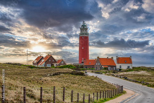 Lighthouse on the Wadden Island of Texel, Netherlands at sunset, dramatic sky photo