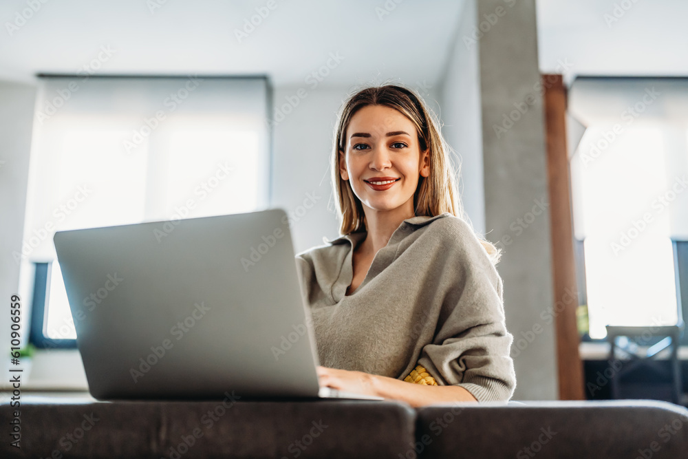Home office. One smiling woman using laptop. Work, freelance, social media, technology concept. Home office. One smiling woman using laptop. Work, freelance, social media, technology concept.