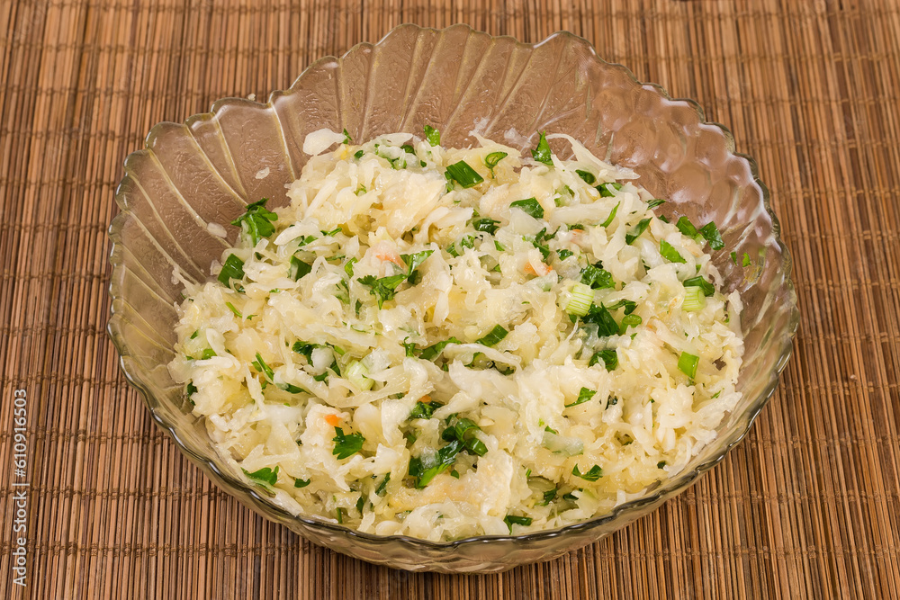 Salad of sauerkraut with carrots and green onion close-up Salad of sauerkraut with carrots and green onion close-up