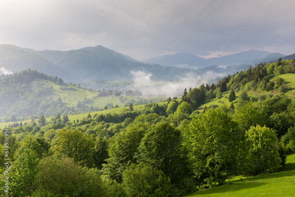 Mountain ridges in sunny windy weather after rain in Carpathians