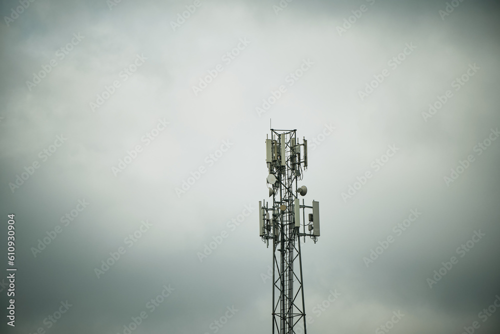 A cell phone LTE and 5g tower with a sky background