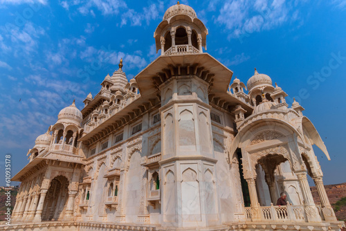 Beautiful architecture of Jaswant Thada cenotaph, Jodhpur, Rajasthan,India. in memory of Maharaja Jaswant Singh II. Makrana marble emitting warm glow when illuminated by the Sun. Blue sky background.