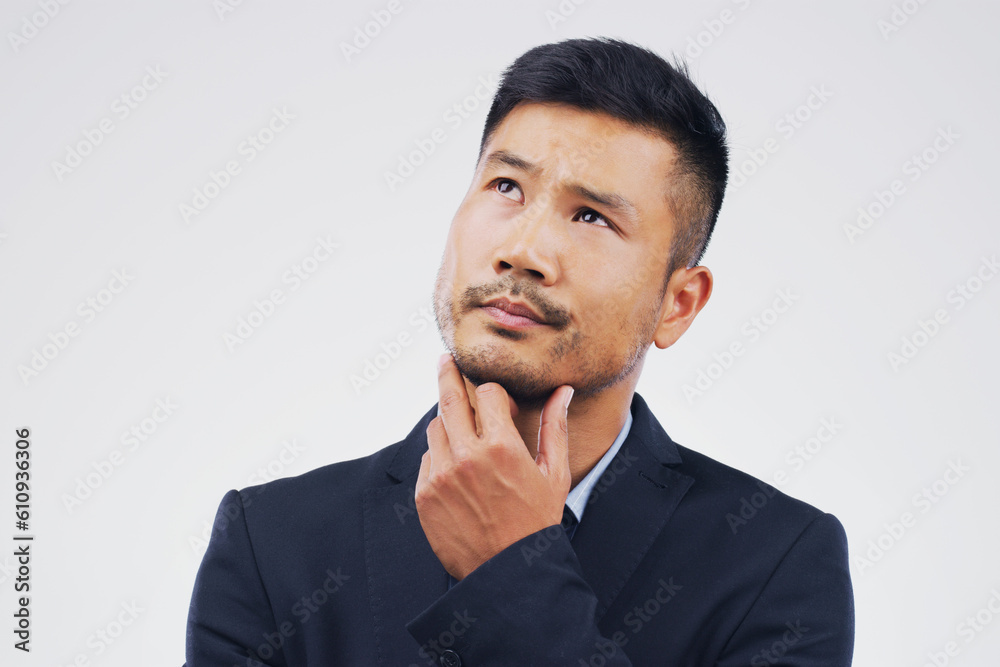Thinking, doubt and an Asian businessman with ideas isolated on a white background in a studio. Idea, space and a corporate employee with a choice, decision or planning a question on a backdrop Thinking, doubt and an Asian businessman with ideas isolated on a white background in a studio. Idea, space and a corporate employee with a choice, decision or planning a question on a backdrop