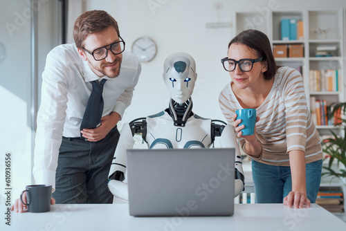 Business people supervising a robot work
