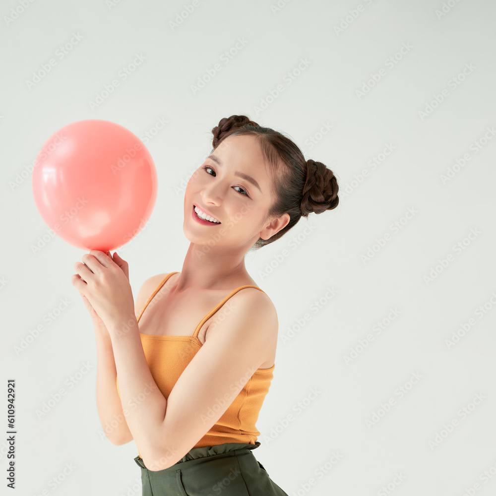 Cute portrait of young Asian woman in tank-top on white background Cute portrait of young Asian woman in tank-top on white background