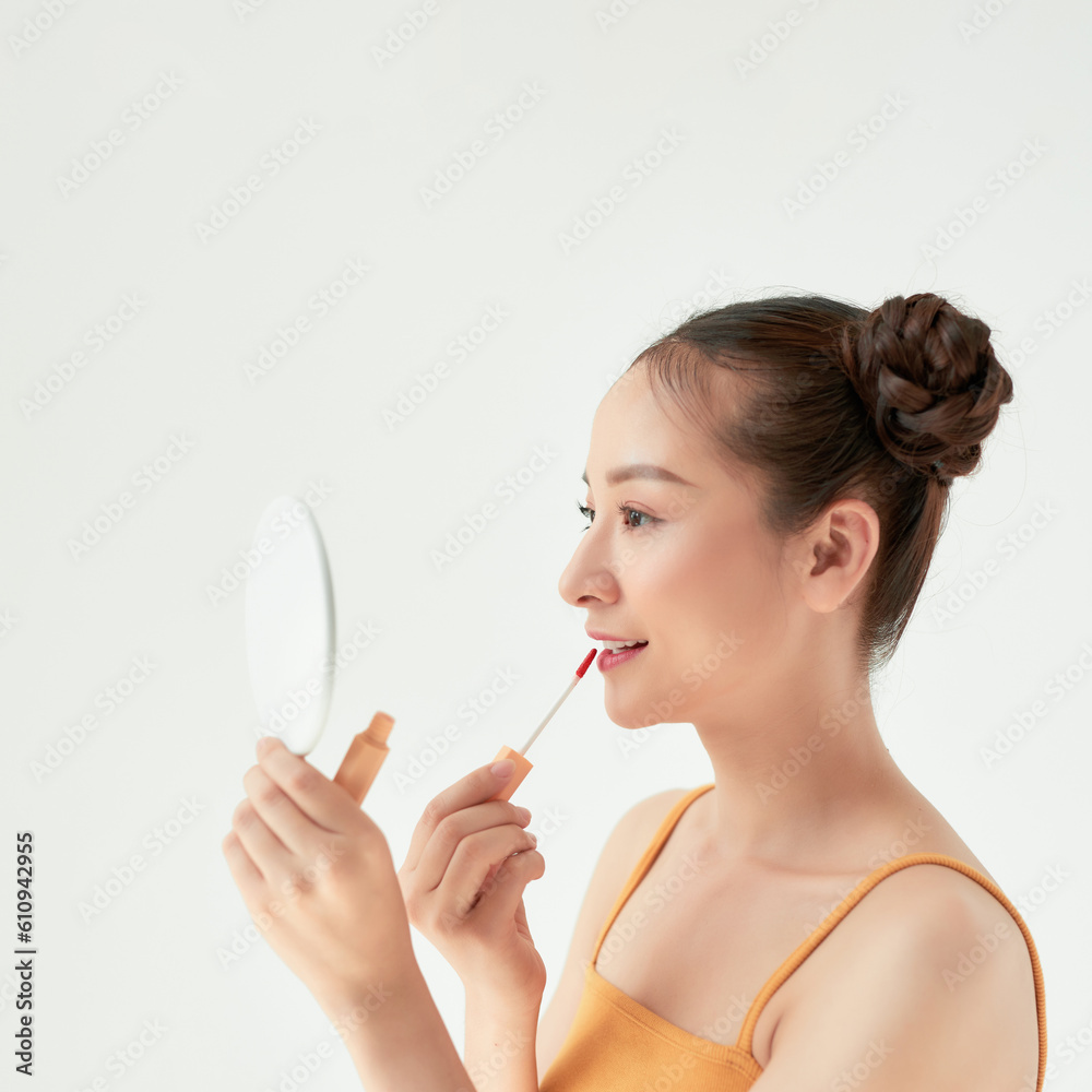 Amazing brown-haired girl doing lips makeup Amazing brown-haired girl doing lips makeup