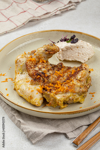 Portion of gourmet cooked chicken with nut cream