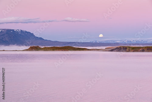 Sunrise in Myvatn lake with fog and moon during the summer season, Iceland