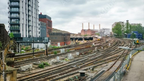 Timelapse of London trains near Victoria Station with Battersea Power Station in background