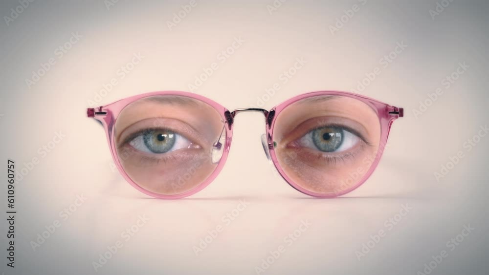 Female Glasses Eyes Look Zoom In. Isolated glasses with female human eyes looking, weird scene
