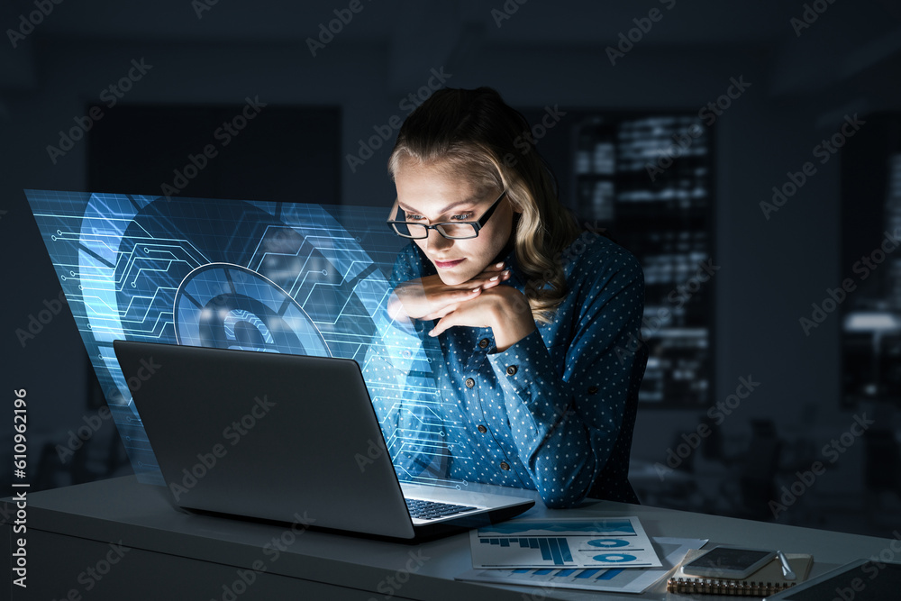 Beautiful blonde in dark office working on laptop and getting net access Beautiful blonde in dark office working on laptop and getting net access