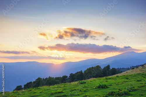 ukrainian highlands in summer. view in to the distant range. sunny sunset in mountains