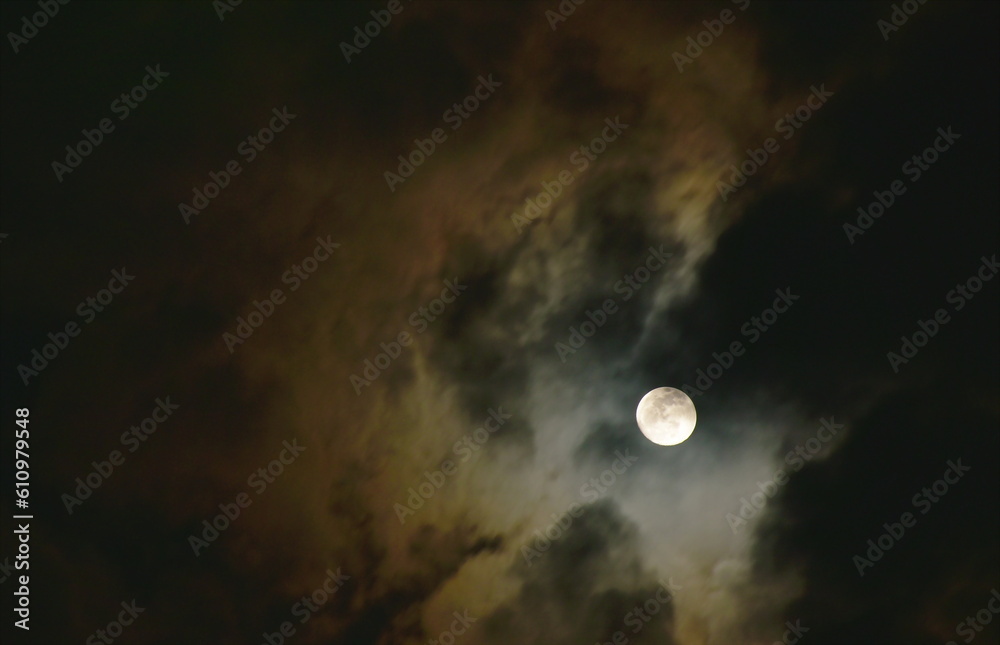 bright moon floating on sky in cloud background 