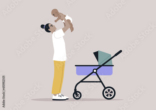 A young playful Asian parent lifting their baby in the air, family bonding