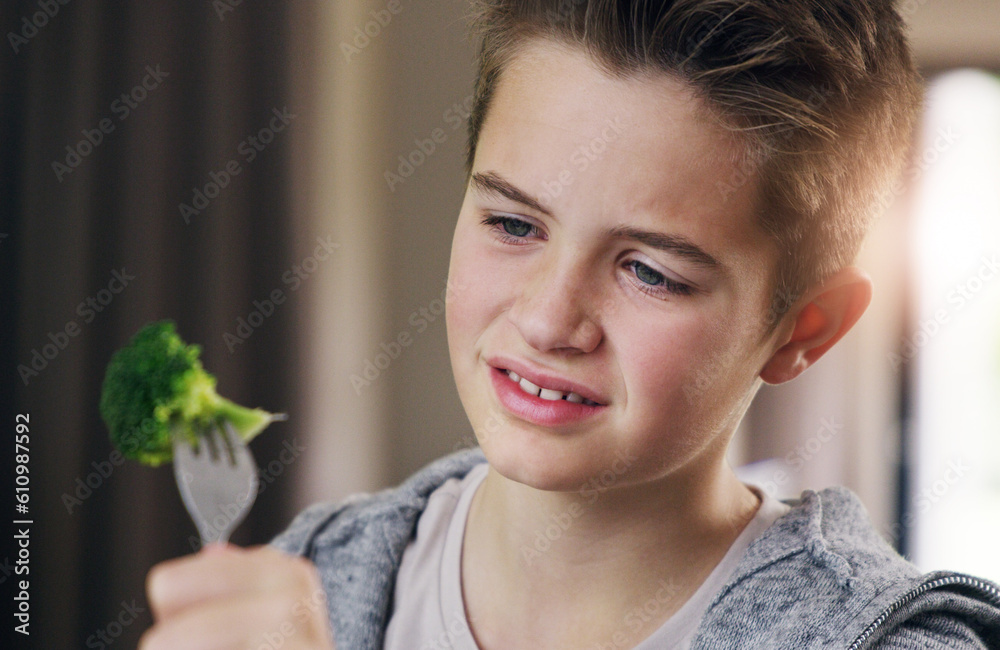 Disgust, food and dislike with child and broccoli for nutrition, health and cooking. Sad, angry and dinner with boy and refuse to eat vegetable at home for eating problem, frustrated and fear Disgust, food and dislike with child and broccoli for nutrition, health and cooking. Sad, angry and dinner with boy and refuse to eat vegetable at home for eating problem, frustrated and fear