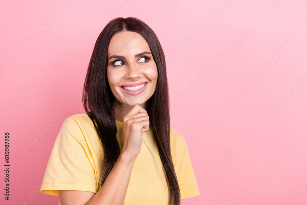 Photo of thoughtful dreamy woman dressed yellow t-shirt arm chin looking empty space isolated pink color background Photo of thoughtful dreamy woman dressed yellow t-shirt arm chin looking empty space isolated pink color background