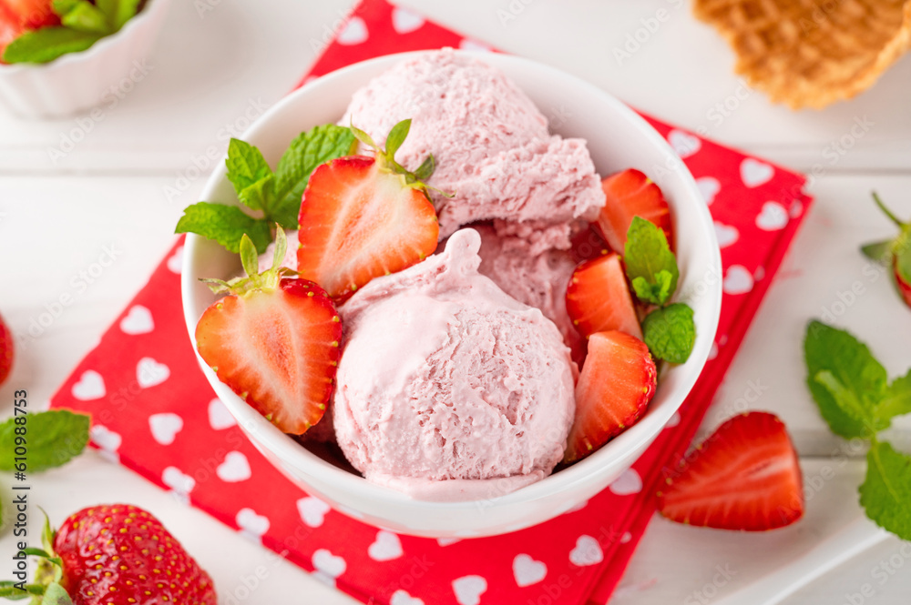 Strawberry ice cream with fresh berries in a bowl on a white wooden background. Selective focus Strawberry ice cream with fresh berries in a bowl on a white wooden background. Selective focus