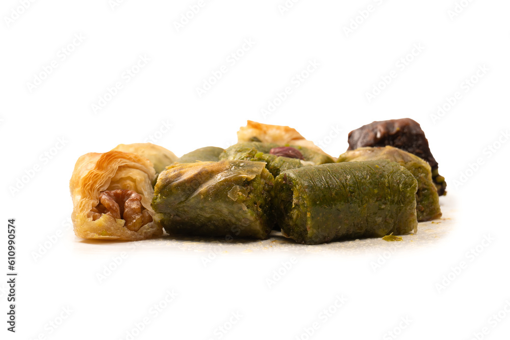 Turkish pistachio baklava isolated on a white background. A variety of turkish sweet baklava. Turkish pistachio baklava isolated on a white background. A variety of turkish sweet baklava.