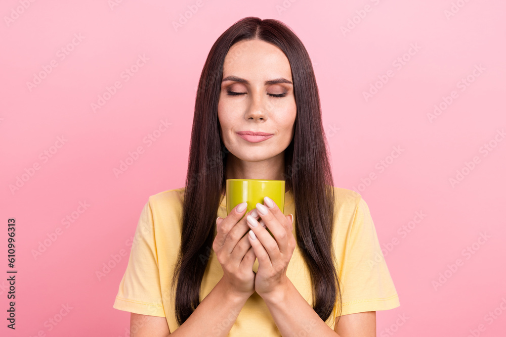 Photo of sweet shiny lady wear yellow t-shirt enjoying coffee closed eyes isolated pink color background Photo of sweet shiny lady wear yellow t-shirt enjoying coffee closed eyes isolated pink color background