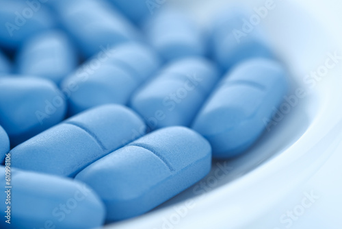 Bild auf Leinwand Heap of Blue pills close up, rotation