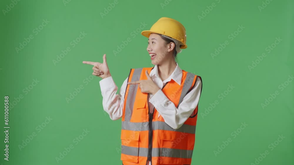 Asian Female Engineer With Safety Helmet Smiling And Pointing To Side While Standing In The Green Screen Background Studio
Asian Female Engineer With Safety Helmet Smiling And Pointing To Side While Standing In The Green Screen Background Studio