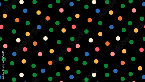 Colorful polka dot pattern on black background.
