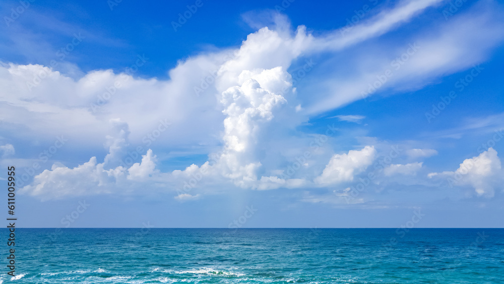 White fluffy clouds with blue sky and little island landscape background