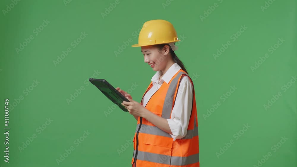 Side View Of Asian Female Engineer With Safety Helmet Looking At The Tablet In Her Hand And Looking Around While Standing In The Green Screen Background Studio
Side View Of Asian Female Engineer With Safety Helmet Looking At The Tablet In Her Hand And Looking Around While Standing In The Green Screen Background Studio